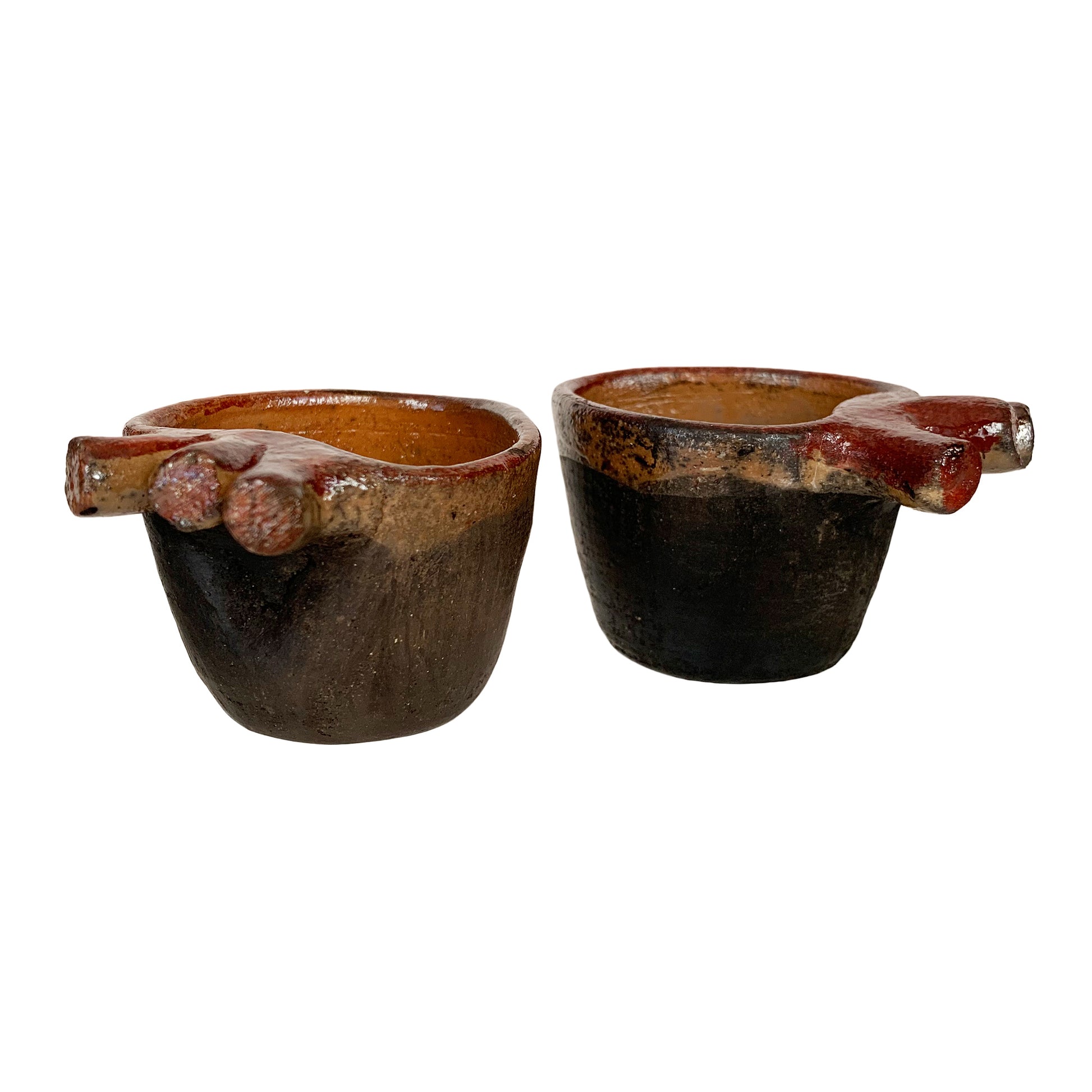 Two traditional jicama cups for drinking mezcal in Mexico, on their  rodete stands. Cups made from